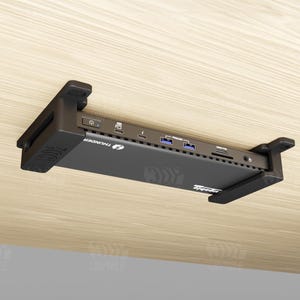 May include: A black Thunderbolt 4 docking station with multiple ports mounted to the underside of a wooden desk.