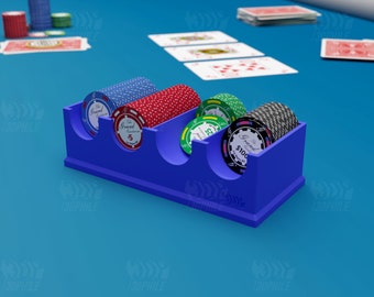 May include: A blue plastic poker chip holder with four compartments. The holder is filled with stacks of poker chips in red, green, and black. The chips have the text "The Grand Casino" and different denominations.