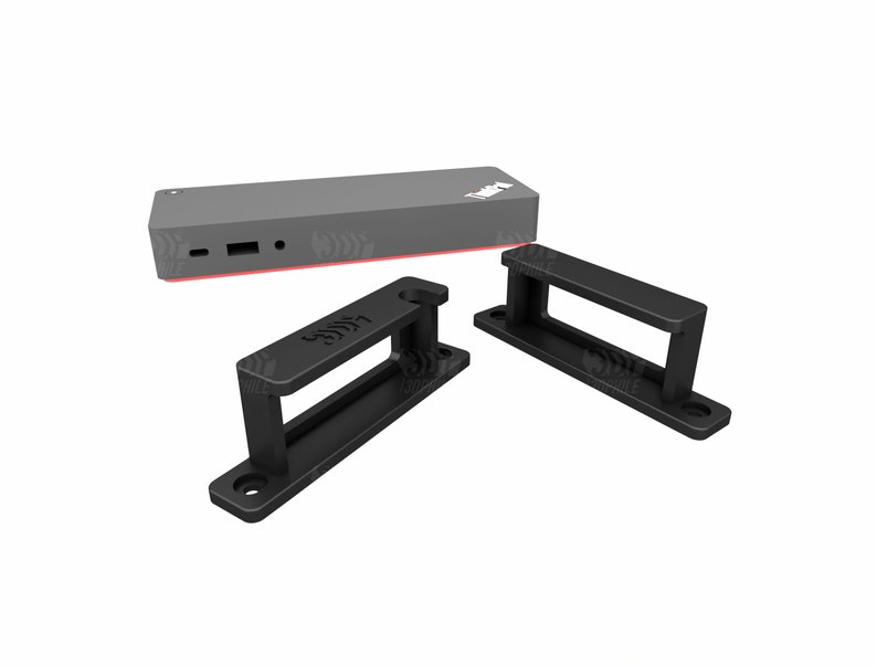 Puede incluir: Un dispositivo rectangular negro con un acento rojo y dos soportes de pl&aacute;stico negro etiquetados como "LATCHES".