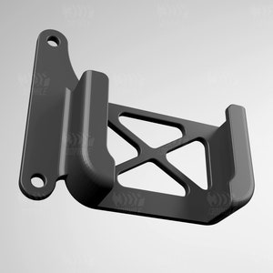 May include: A black plastic phone holder with a geometric design. The holder has a curved back and a flat front with a cutout for a phone.