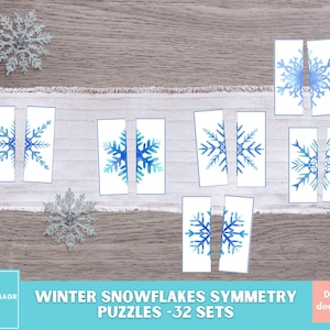May include: A set of 32 printable winter snowflake symmetry puzzles. Each puzzle is made up of two pieces, showing half of a blue watercolor snowflake. The puzzles are perfect for kids to practice their fine motor skills and learn about symmetry.