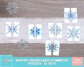 May include: A set of 32 printable winter snowflake symmetry puzzles. Each puzzle is made up of two pieces, showing half of a blue watercolor snowflake. The puzzles are perfect for kids to practice their fine motor skills and learn about symmetry.