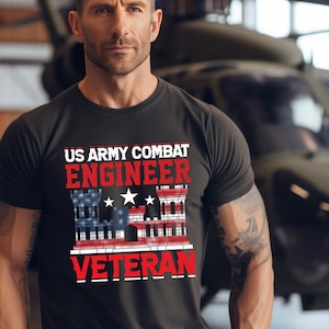 May include: A black t-shirt with a red and white American flag design. The text "US Army Combat Engineer Veteran" is printed on the shirt.