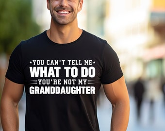 May include: A black t-shirt with white text that reads "*You can't tell me* WHAT TO DO *You're not my* GRANDDAUGHTER".