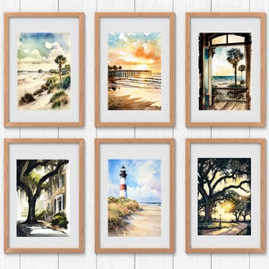 May include: Six framed watercolor paintings depicting various scenes of a coastal town. The paintings feature a beach with palm trees, a pier at sunset, a view from a window, a tree-lined street, a lighthouse on a beach, and a tree-lined path at sunset.