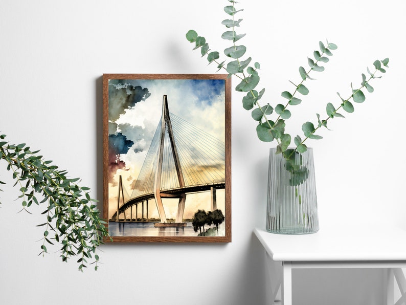 May include: A watercolor painting of a bridge with a sunset in the background. The bridge is a cable-stayed bridge with a white structure and a yellow road.