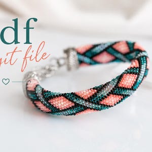 May include: A beaded bracelet with a geometric pattern in coral, teal, and black. The bracelet has a silver clasp and is displayed on a white surface. Text in the image reads "pdf digit file".