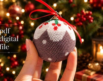 Op de afbeelding: Een met kralen versierde kerstbal met een rood lint. De ornament is wit, bruin en groen, met een patroon van bessen en bladeren. De tekst "pdf digital file" staat in de afbeelding.