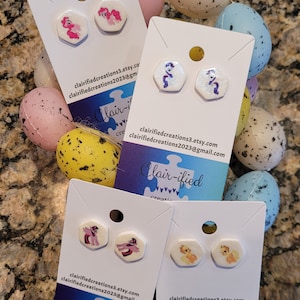 May include: Four cards with white backgrounds and colorful images of cartoon ponies. The cards have the text "Clair-ified creations" and contact information for the seller.