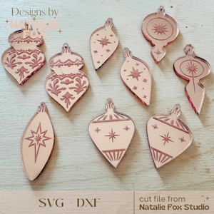 Könnte beinhalten: Neun roségoldene Weihnachtsbaumschmuck-Schnittdateien mit verschiedenen Designs mit Sternen und geometrischen Mustern. SVG - DXF Schnittdatei von Natalie Fox Studio.