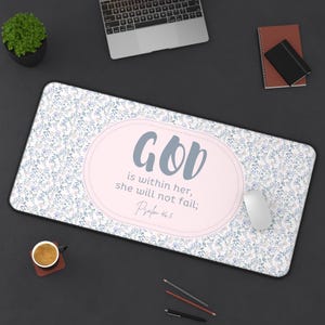 May include: A rectangular floral mousepad with a light pink oval in the center. The oval contains the words "GOD is within her, she will not fail; Psalm 46:5" in gray script. The mousepad has a white background with blue and purple floral patterns.