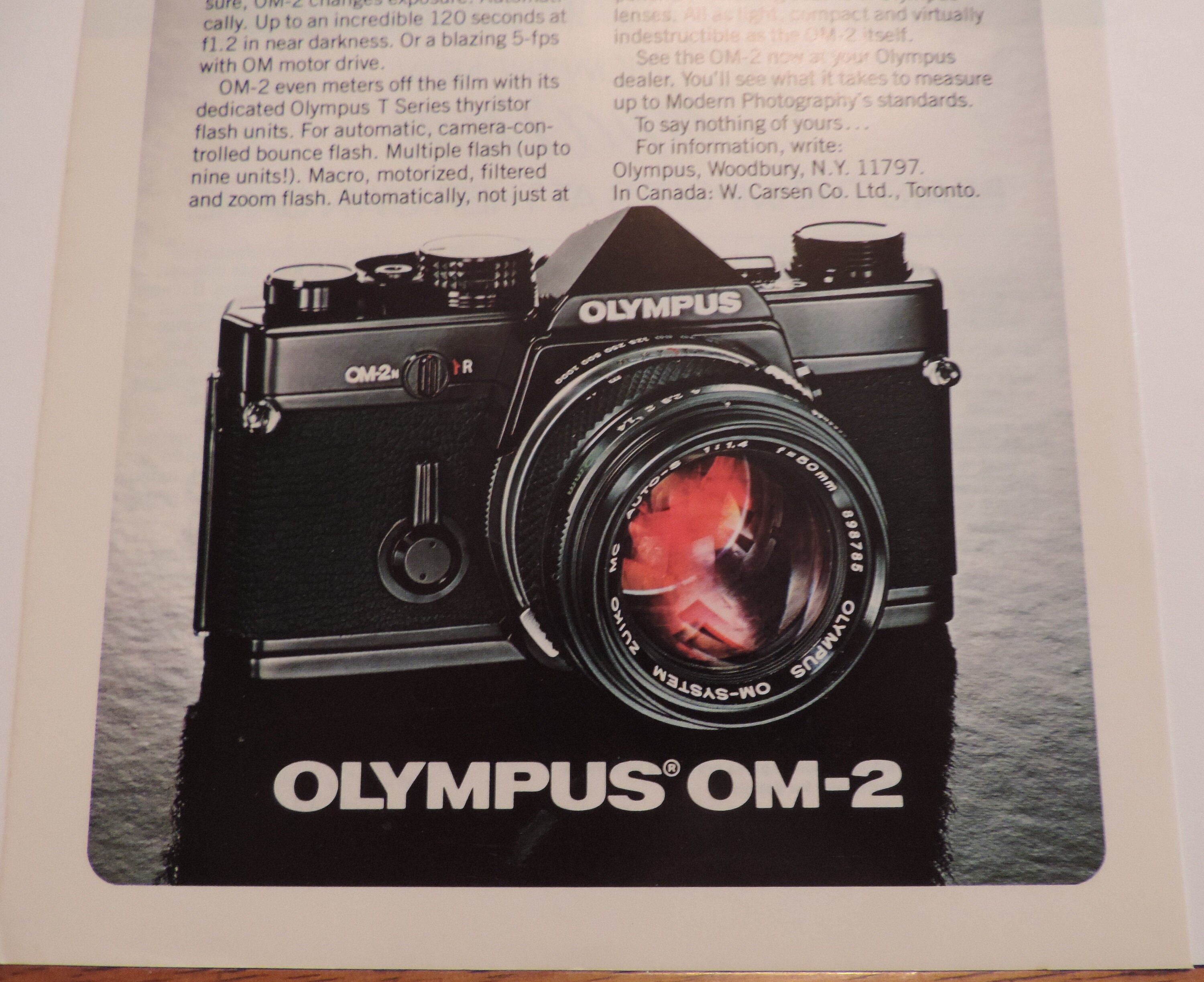 1982 Olympus OM-2 Camera / Cadillac Cimarron Full Page Color Print Ad ...
