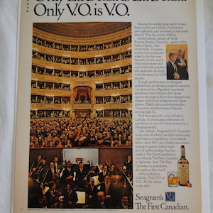 May include: A vintage advertisement for Seagram's V.O. Canadian whisky, featuring a photo of the interior of the La Scala opera house in Milan, Italy. The ad text reads "Only La Scala is La Scala. Only V.O. is V.O." and highlights the unique qualities of both the opera house and the whisky.