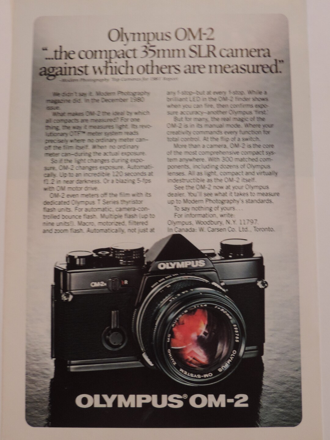 1982 Olympus OM-2 Camera / Cadillac Cimarron Full Page Color Print Ad ...
