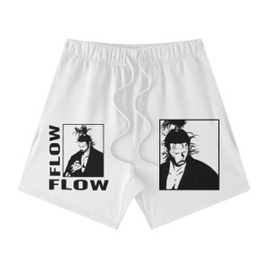 May include: White athletic shorts with a black and white illustration of a person with a topknot. The text "FLOW" is printed on the shorts twice.