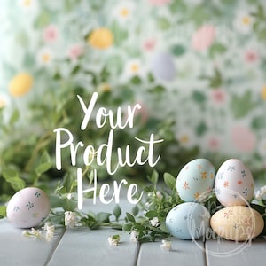 May include: Four Easter eggs with pastel colors and floral patterns on a light blue wooden surface with green foliage and white flowers. The text "Your Product Here" is written in white on a green background.