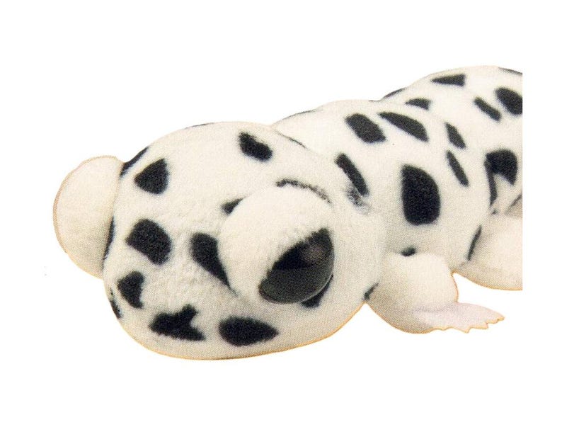 May include: A plush toy shaped like a Dalmatian dog. The toy is white with black spots and has large, black eyes. It has small, rounded ears and a small tail. The toy is made of a soft, fuzzy material.