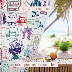 May include: White blackout curtains with colorful travel stamp designs, including landmarks and country names. The text "blackout curtains" and "add your own countries" are visible. Two coconuts sit on a white plate on a bamboo surface.