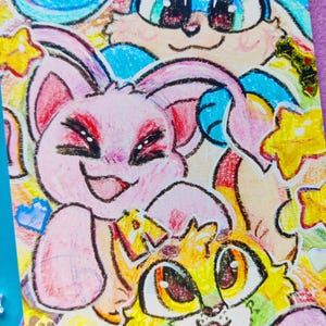 May include: A colorful illustration featuring three cartoon animals with large eyes and smiling faces. The top animal is blue, the middle is pink, and the bottom is yellow and green. The text "Panda Parfait" is visible.