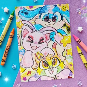 Photo of a 5x7" print of 3 colorful virtual pet characters stacked on top of each other, drawn in crayons. The background is colored paper, crayons, and star beads.