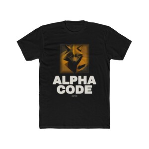 May include: A black short-sleeved t-shirt featuring a graphic of a stylised, geometric fox head in shades of gold and brown. Below the graphic, the text "ALPHA CODE" is printed in large, bold, white capital letters, with "USNOTTHEW" below it.