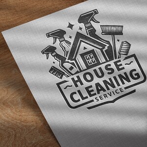 May include: Black and white logo design for a house cleaning service. The logo features a house with cleaning supplies, including a spray bottle, a broom, and a sponge. The text "House Cleaning Service" is displayed in a bold font.