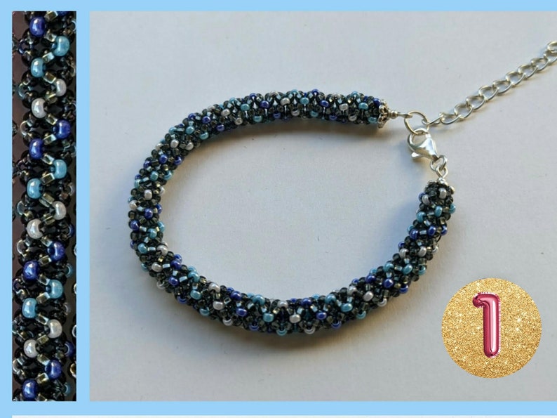 May include: A beaded bracelet with a silver clasp. The bracelet is made with black, blue, and white beads. The beads are arranged in a spiral pattern. The bracelet is on a white background with a gold circle containing the number '1'.