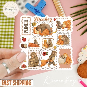 May include: A sheet of stickers featuring various monkey illustrations in a cartoon style. The stickers include the word "Monkey" in a decorative font, along with images of monkeys in different poses, surrounded by decorative frames.