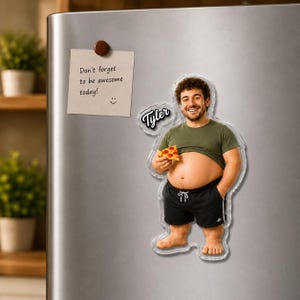 May include: A custom acrylic refrigerator magnet featuring a cutout of a smiling person wearing an olive green t-shirt and black shorts, holding a slice of pepperoni pizza. The name Tyler is printed in a script font next to the figure.