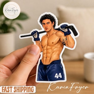 May include: A sticker featuring a muscular person with a hockey stick. The person is wearing blue shorts with the number 44. The sticker has the text "Karin Fryer" and "Sublimation Designs".