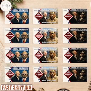 May include: A collection of twelve rectangular cards featuring the text America The Beautiful, Resident Annual, and Resist. Protect. Explore. Each card displays a portrait of George Washington alongside a bear wearing a park ranger hat.