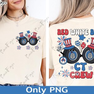 May include: Cream-colored t-shirt featuring a patriotic design with two cartoon tires wearing Uncle Sam hats. The front design includes fireworks and stars. The back of the shirt displays the text "RED WHITE BLUE CT CREW".