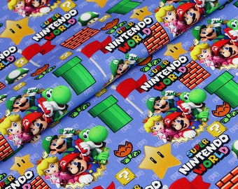 May include: Blue fabric with a repeating pattern of Super Nintendo World text, red flags, green pipes, stars, question marks, and characters from the Super Mario Bros. video game franchise. The characters include Mario, Luigi, Yoshi, and Princess Peach.