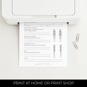 May include: A white printer printing a client information form. The form includes sections for subjective and objective symptoms, assessment goals, and a plan. Two silver paper clips are on the white surface. The text at the bottom reads "PRINT AT HOME OR PRINT SHOP."