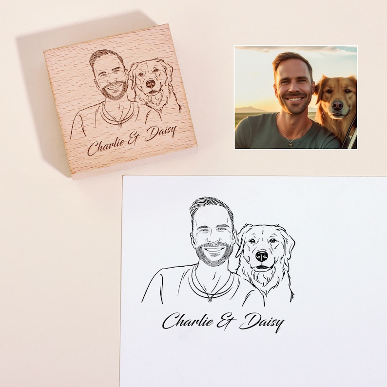 May include: A wooden stamp with a black and white line drawing of a man and a dog. The text "Charlie & Daisy" is engraved on the stamp.