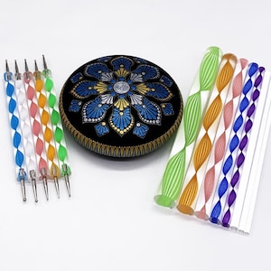 May include: A set of dotting tools for rock painting. The set includes a variety of sizes and colors of dotting tools, as well as a painted rock with a mandala design.