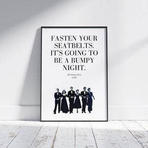 May include: A black and white poster featuring a quote from the film "All About Eve" (1950). The quote reads: "Fasten your seatbelts. It's going to be a bumpy night."