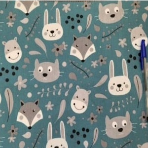 Happy animals pattern with teal background 100% cotton fabric - sold by the meter.