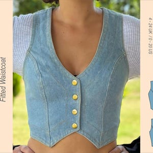 May include: Pale blue denim fitted waistcoat with a V-neck and gold buttons. The garment has a tailored fit. The image also includes the text "Myrtle's Dream 22029 Fitted Waistcoat" and a diagram. Sizes 10-20 UK are indicated.