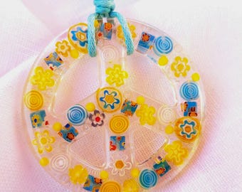 Colorful peace sign, peace sign made of millefiori beads in epoxy resin