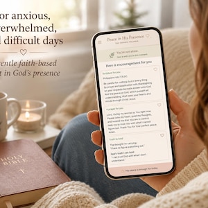 May include: A smartphone displaying the "Peace in His Presence" app, with encouraging text. Beside it, a mug with "Be still and know" printed on it, a lit candle, and a closed Holy Bible. The image conveys a theme of faith and comfort.