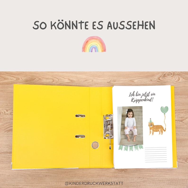 May include: A yellow binder with a white page showing a photo of a child with a rainbow and the text "Ich bin jetzt ein Krippenkind!" (I am now a nursery child!).