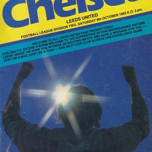 May include: A vintage Chelsea Match Magazine cover from October 9, 1982, featuring a blue and yellow design with the word "Chelsea" prominently displayed. The cover includes text about the football match between Chelsea and Leeds United.