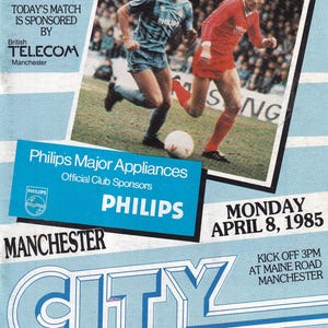 May include: Match magazine cover featuring a soccer match between Manchester City and Leeds United. The image includes players in action, the Philips logo, and the date: Monday, April 8, 1985. The price is 50p.