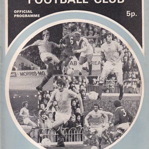 May include: Vintage Manchester City Football Club official program cover. The cover features a collage of black and white action shots of players in light blue and white uniforms. Text includes "MANCHESTER CITY FOOTBALL CLUB" and "CITY v LIVERPOOL".