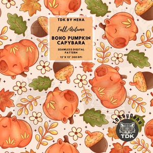 May include: A seamless digital pattern featuring orange capybaras shaped like pumpkins, brown acorns, green oak leaves, and small white flowers on a light beige background. Text reads TDK BY NEHA, Fall/Autumn, BOHO PUMPKIN CAPYBARA, 12" X 12" 300 DPI.