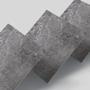 Op de afbeelding: Drie grijze, getextureerde tegels die in een verspringend patroon zijn gerangschikt, waardoor een visueel effect van een trap ontstaat.