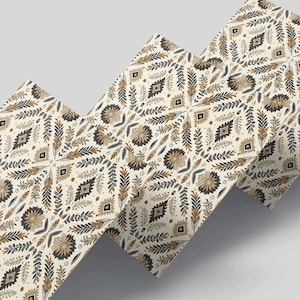 May include: Three patterned sheets of paper with a geometric design featuring brown, black, and white colours. The design is a repeating pattern of leaves and diamonds.