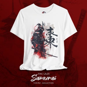 May include: White t-shirt featuring a detailed illustration of a samurai warrior in armor with red and black accents. Japanese characters are to the right of the warrior. The text "THE LAST Samurai T-SHIRT COLLECTION" is at the bottom.