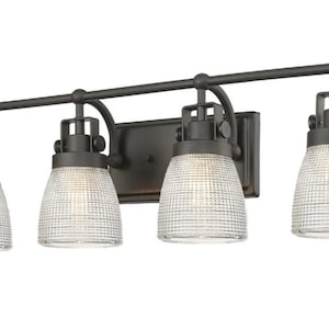 May include: Four-light black vanity light fixture with clear glass shades featuring a textured grid pattern.